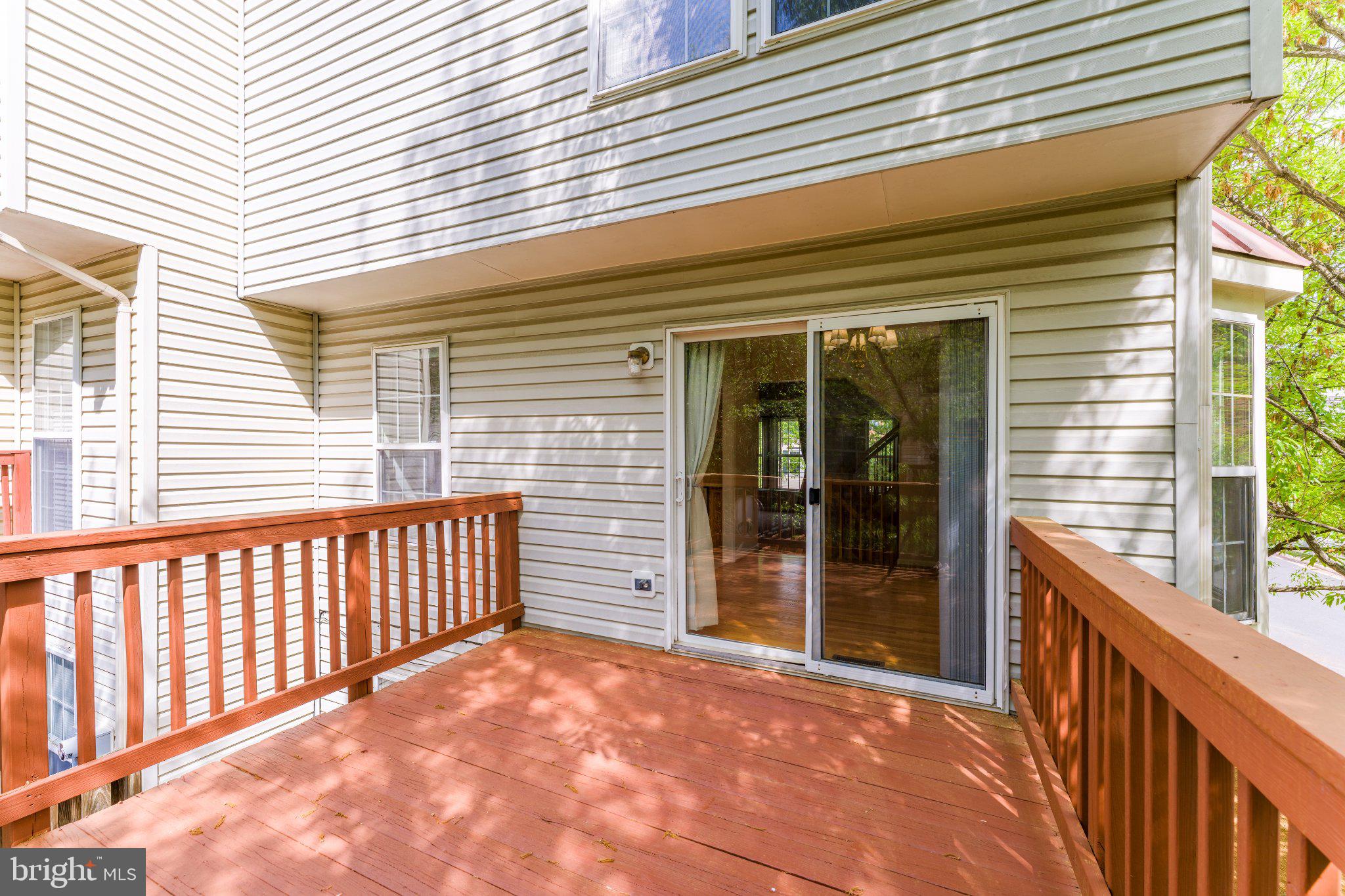 6414 Lureta Ann Lane Springfield, VA 22150 - Photo 40 of 44 a view of a porch with wooden floor and fence