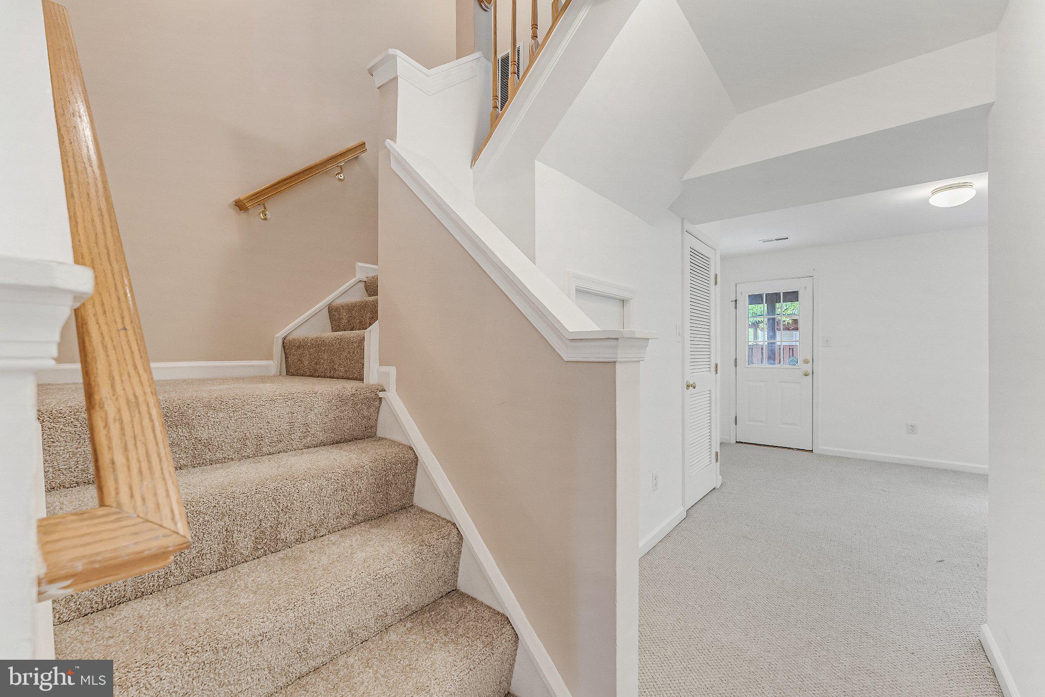 6414 Lureta Ann Lane Springfield, VA 22150 - Photo 44 of 44 a living room with furniture and stairs