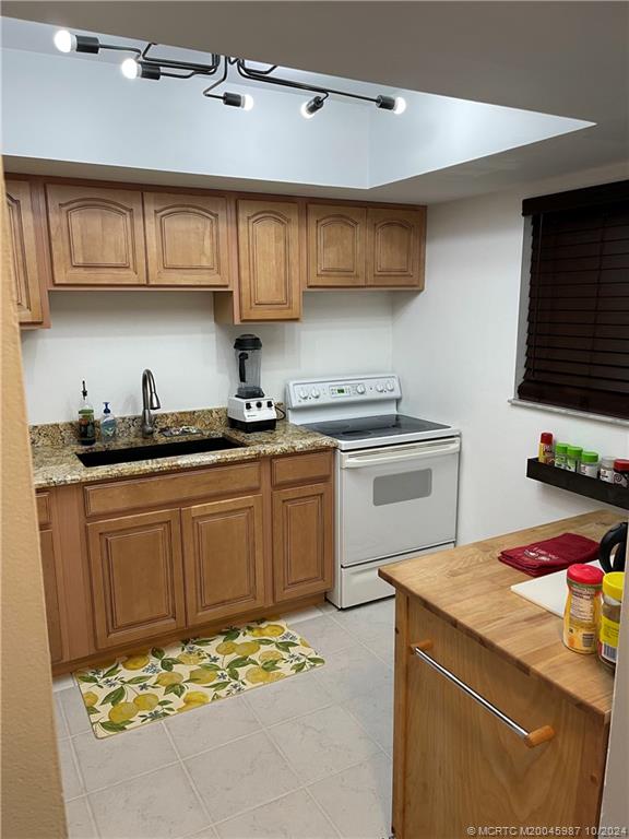 1900 South Kanner Highway, Unit 9202 Stuart, FL 34994 - Photo 12 of 55 a kitchen with stainless steel appliances granite countertop a sink stove and microwave