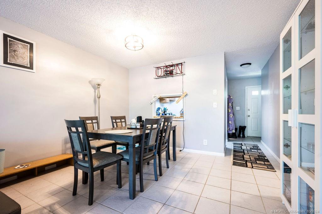 1900 South Kanner Highway, Unit 9202 Stuart, FL 34994 - Photo 22 of 55 a view of a dining room with furniture and chandelier