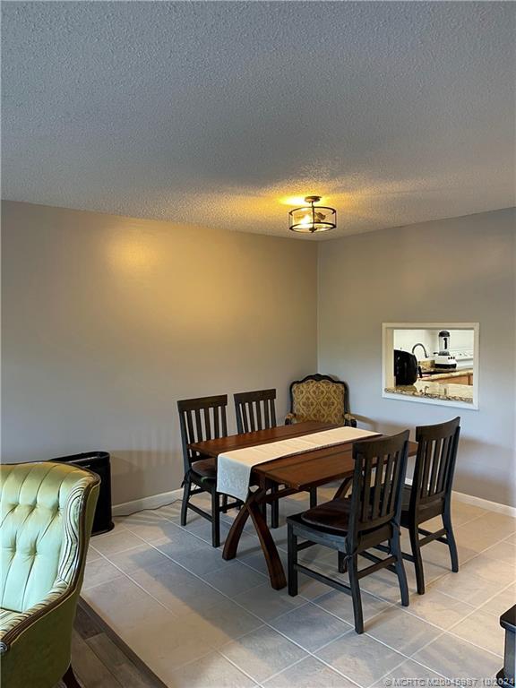1900 South Kanner Highway, Unit 9202 Stuart, FL 34994 - Photo 23 of 55 a view of a dining room with furniture and chandelier
