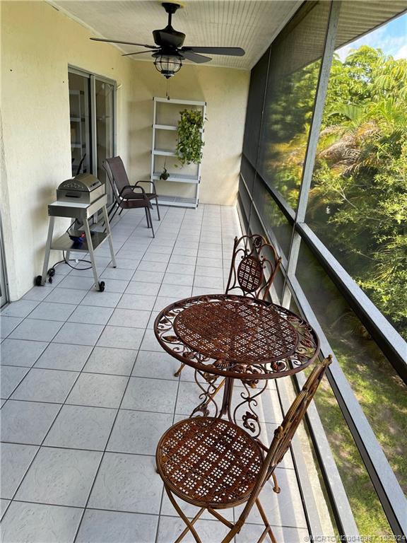 1900 South Kanner Highway, Unit 9202 Stuart, FL 34994 - Photo 25 of 55 a living room with a couch and a table