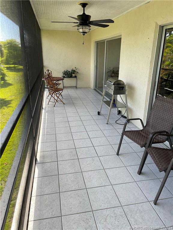 1900 South Kanner Highway, Unit 9202 Stuart, FL 34994 - Photo 27 of 55 a view of a workspace with furniture and a window