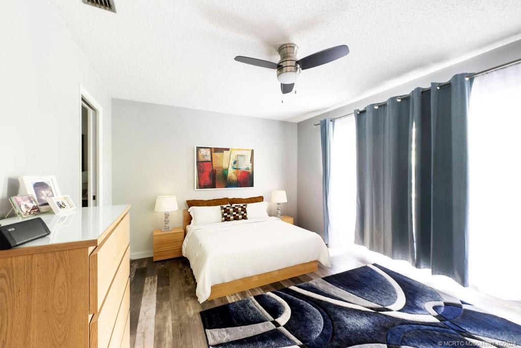 1900 South Kanner Highway, Unit 9202 Stuart, FL 34994 - Photo 32 of 55 a bedroom with furniture and a window