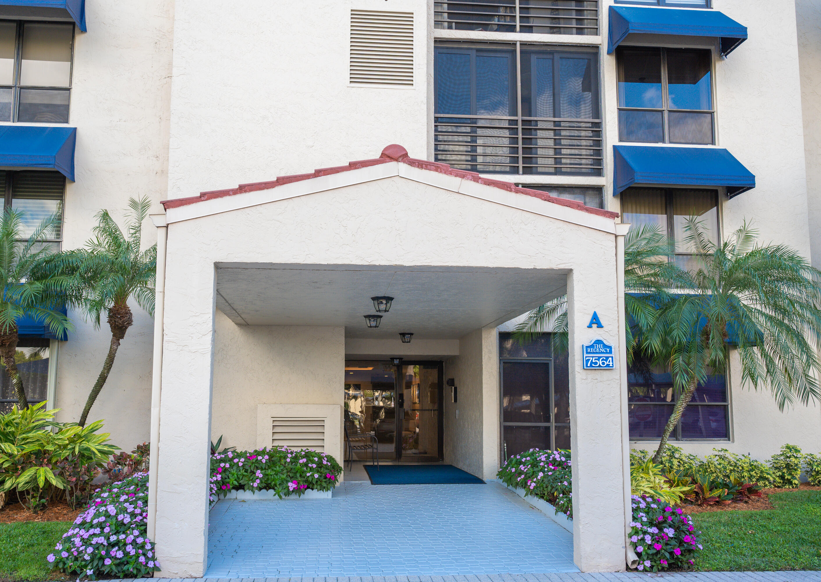 7564 Regency Lake Drive, Unit A101 Boca Raton, FL 33433 - Photo 32 of 33 Covered Secured Entrance