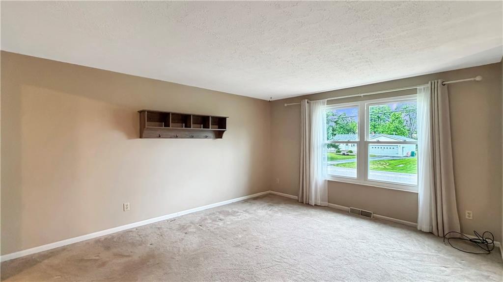 130 Shenango Road New Castle, PA 16105 - Photo 8 of 23 The living room is bright and inviting.