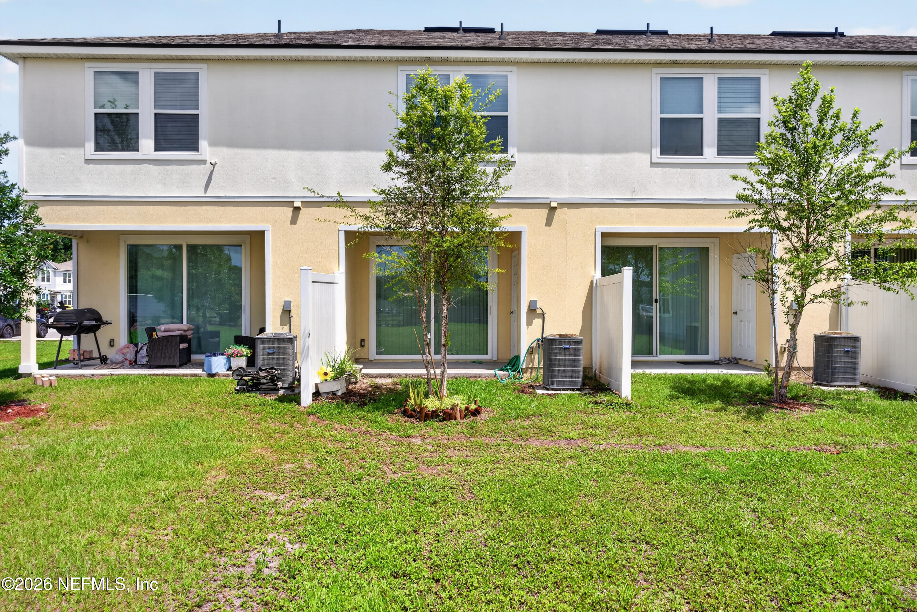 8210 Larose Road Jacksonville, FL 32211 - Photo 30 of 38 a view of a house with a yard and sitting area