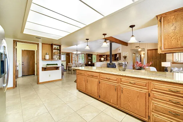 a room with furniture a rug and a book shelf