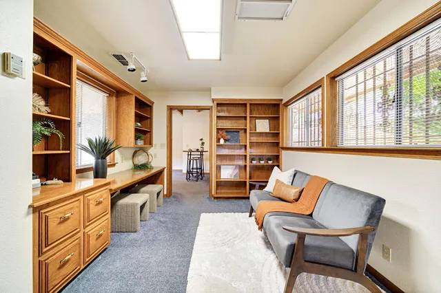 a bedroom with a bed and a potted plant