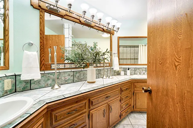 a spacious bedroom with a large bed and a window