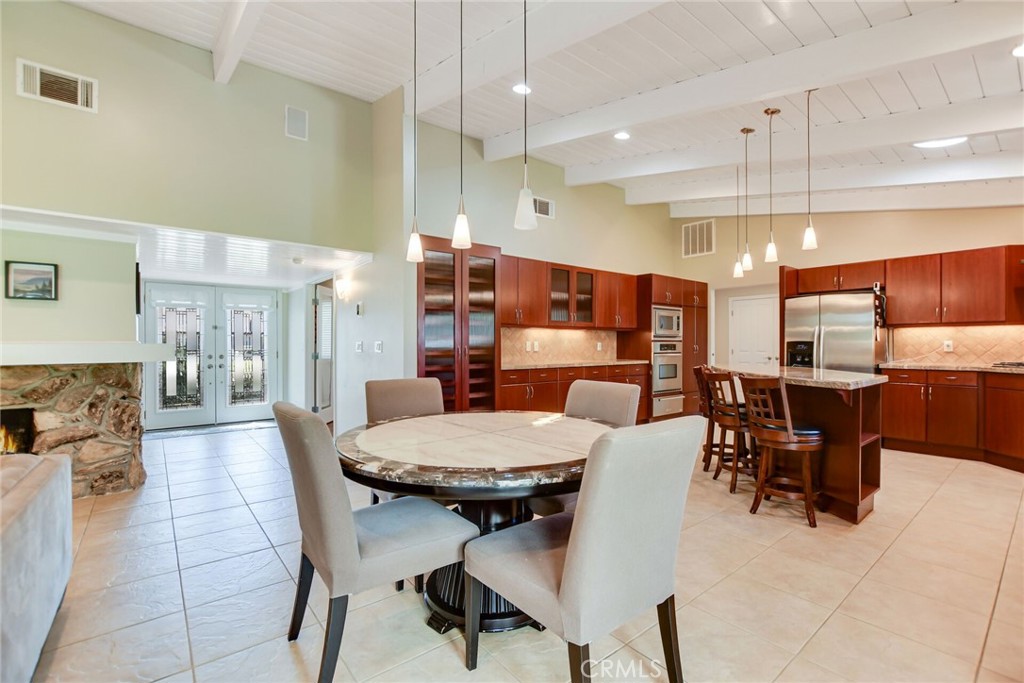 5531 Cornwall Avenue Riverside, CA 92506 - Photo 15 of 69 a large kitchen with a table and chairs