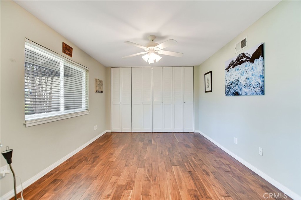 5531 Cornwall Avenue Riverside, CA 92506 - Photo 22 of 69 a view of empty room with wooden floor and fan