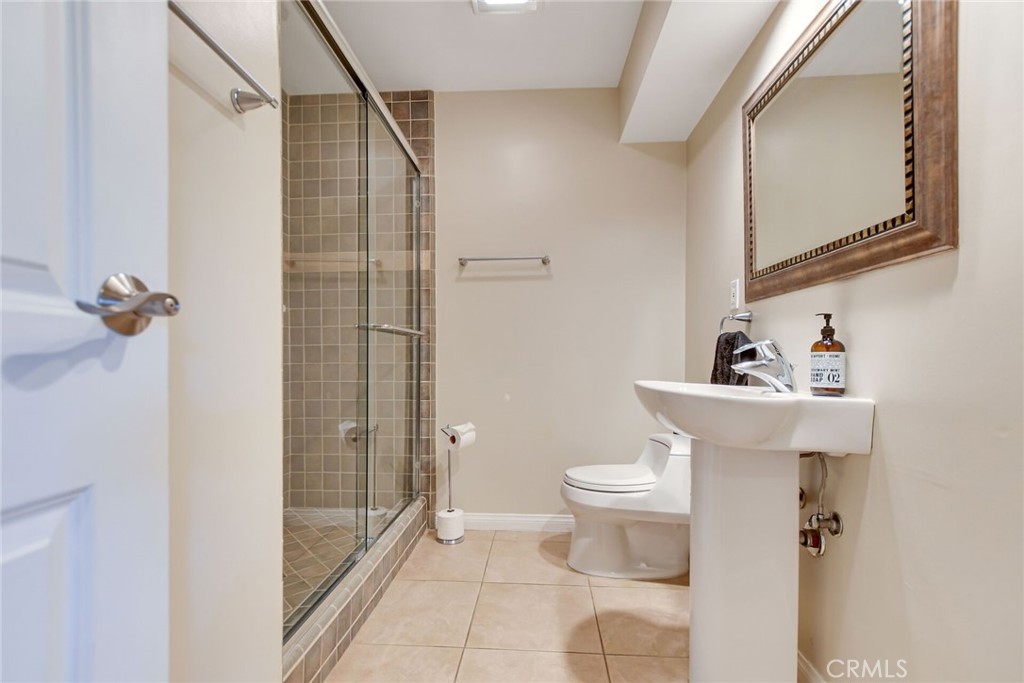 5531 Cornwall Avenue Riverside, CA 92506 - Photo 24 of 69 a bathroom with a toilet sink and shower