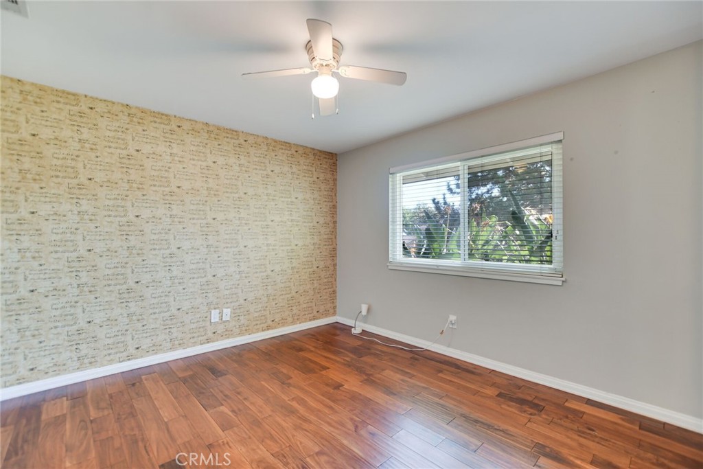 5531 Cornwall Avenue Riverside, CA 92506 - Photo 26 of 69 wooden floor in an empty room with a window