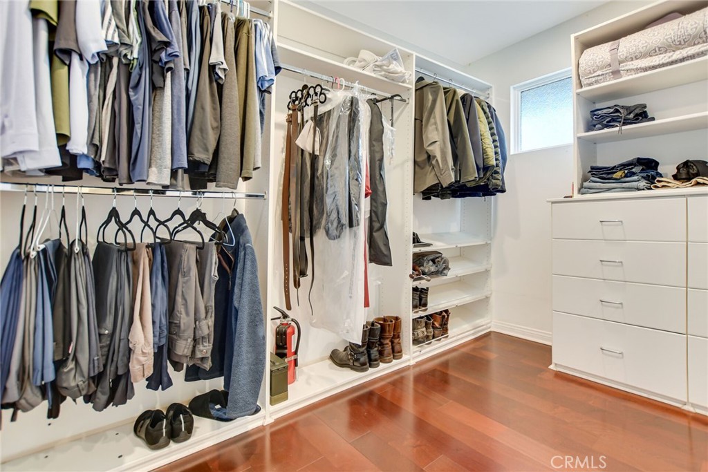 5531 Cornwall Avenue Riverside, CA 92506 - Photo 31 of 69 a view of walk in closet with clothes and shoes