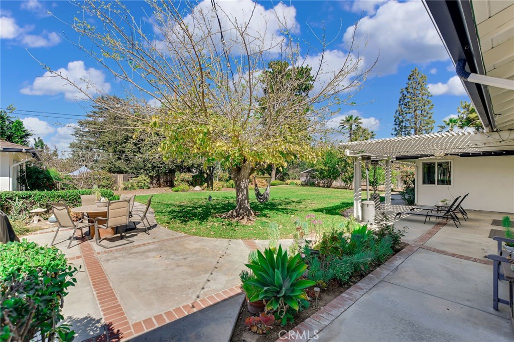 5531 Cornwall Avenue Riverside, CA 92506 - Photo 35 of 69 a view of a patio with chairs and a table