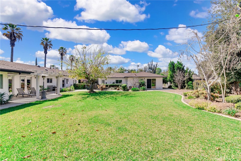 5531 Cornwall Avenue Riverside, CA 92506 - Photo 37 of 69 a view of a house with a big yard plants and large trees