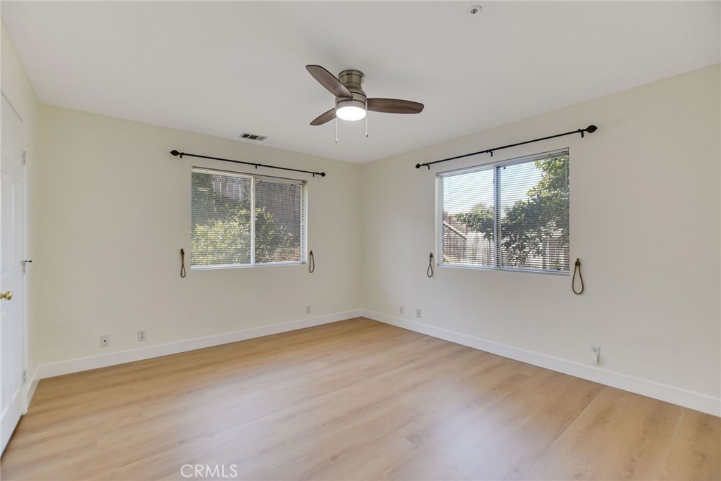 5531 Cornwall Avenue Riverside, CA 92506 - Photo 46 of 69 a view of an empty room with a window and wooden floor