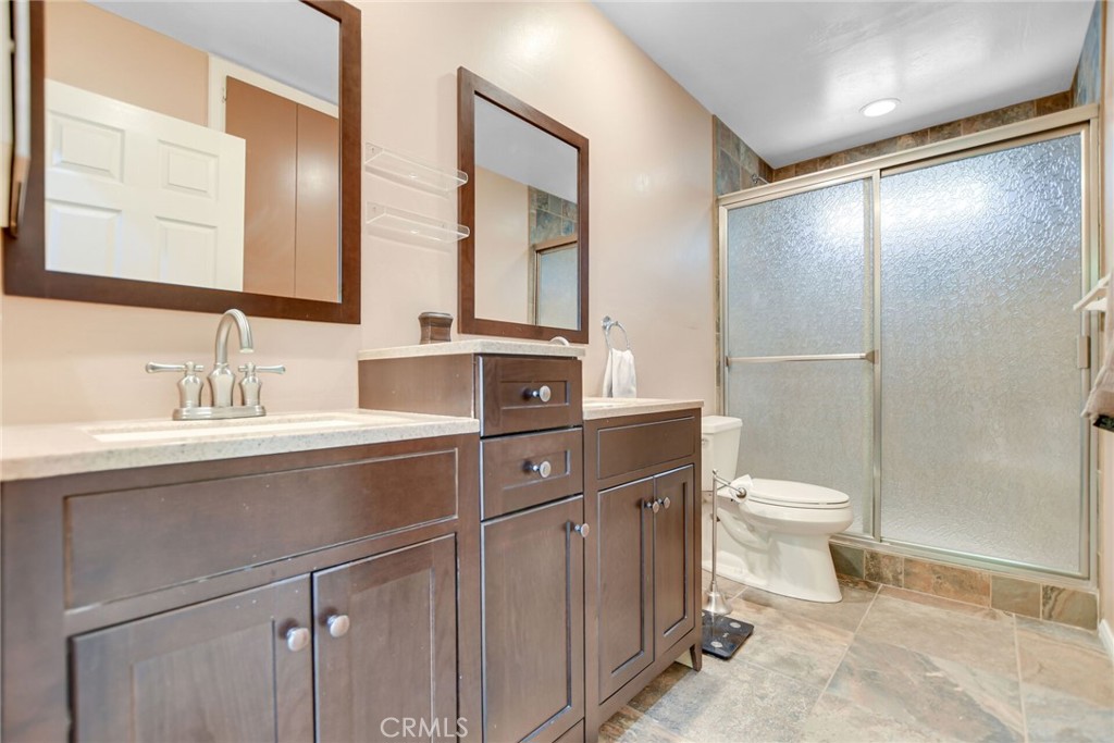 5531 Cornwall Avenue Riverside, CA 92506 - Photo 48 of 69 a bathroom with a sink toilet and shower