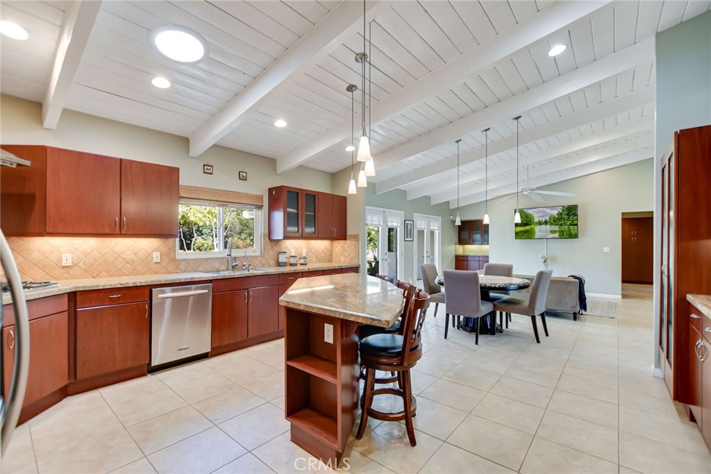 5531 Cornwall Avenue Riverside, CA 92506 - Photo 10 of 69 a kitchen with stainless steel appliances granite countertop table chairs sink and cabinets