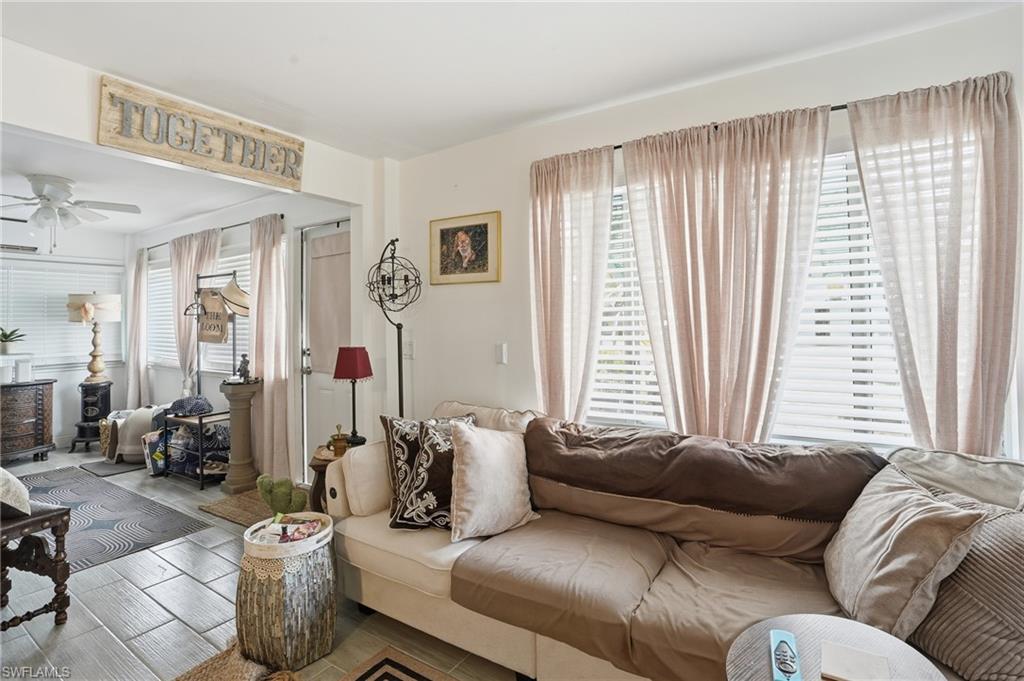 5474 Oak Ridge Avenue Fort Myers Beach, FL 33931 - Photo 12 of 50 a living room with furniture and a large window
