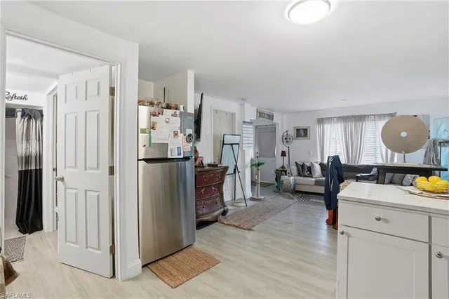 a bedroom with a bed couch and a window