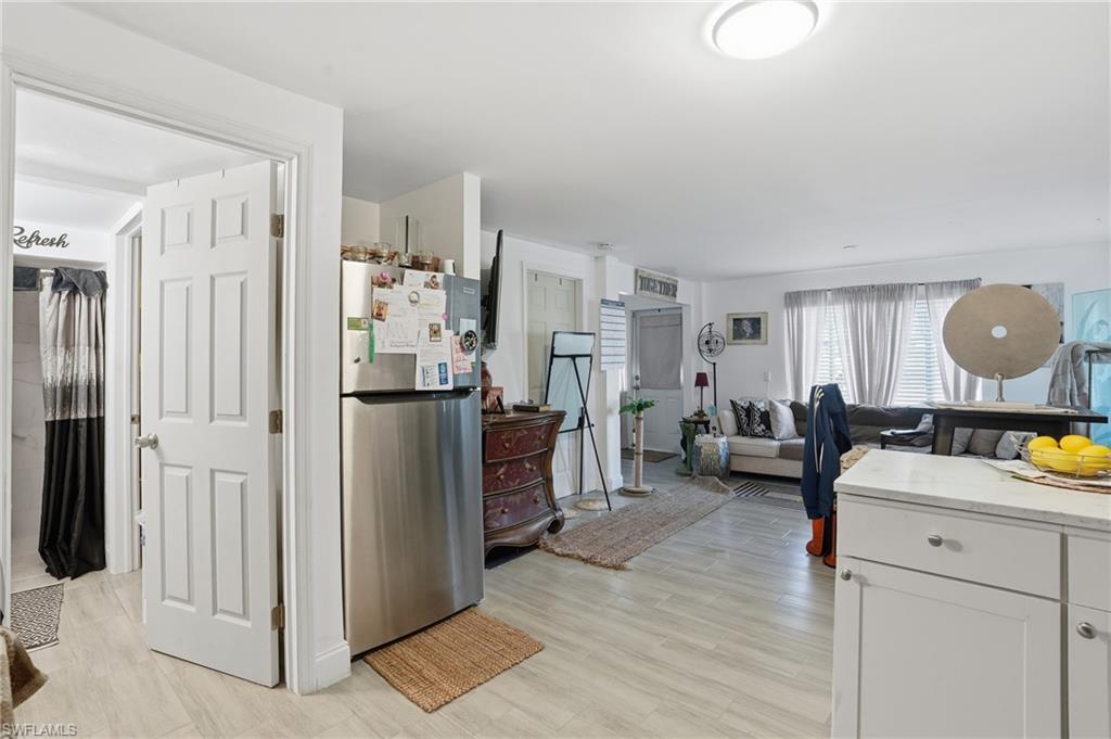 5474 Oak Ridge Avenue Fort Myers Beach, FL 33931 - Photo 14 of 50 a living room with furniture and a wooden floor