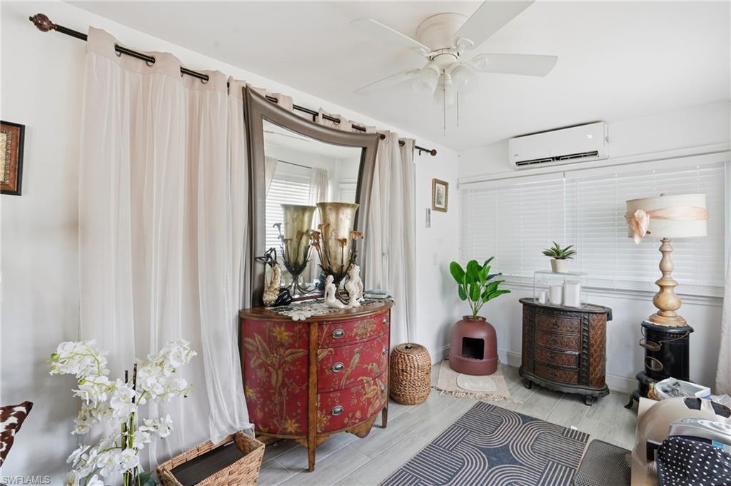 5474 Oak Ridge Avenue Fort Myers Beach, FL 33931 - Photo 17 of 50 a living room with furniture and a chandelier