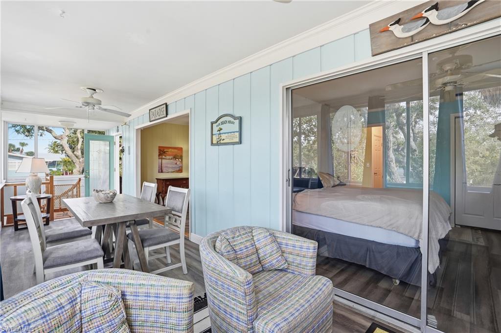 5474 Oak Ridge Avenue Fort Myers Beach, FL 33931 - Photo 22 of 50 a living room with furniture and a large window