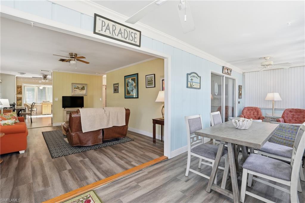 5474 Oak Ridge Avenue Fort Myers Beach, FL 33931 - Photo 23 of 50 a living room with furniture and wooden floor