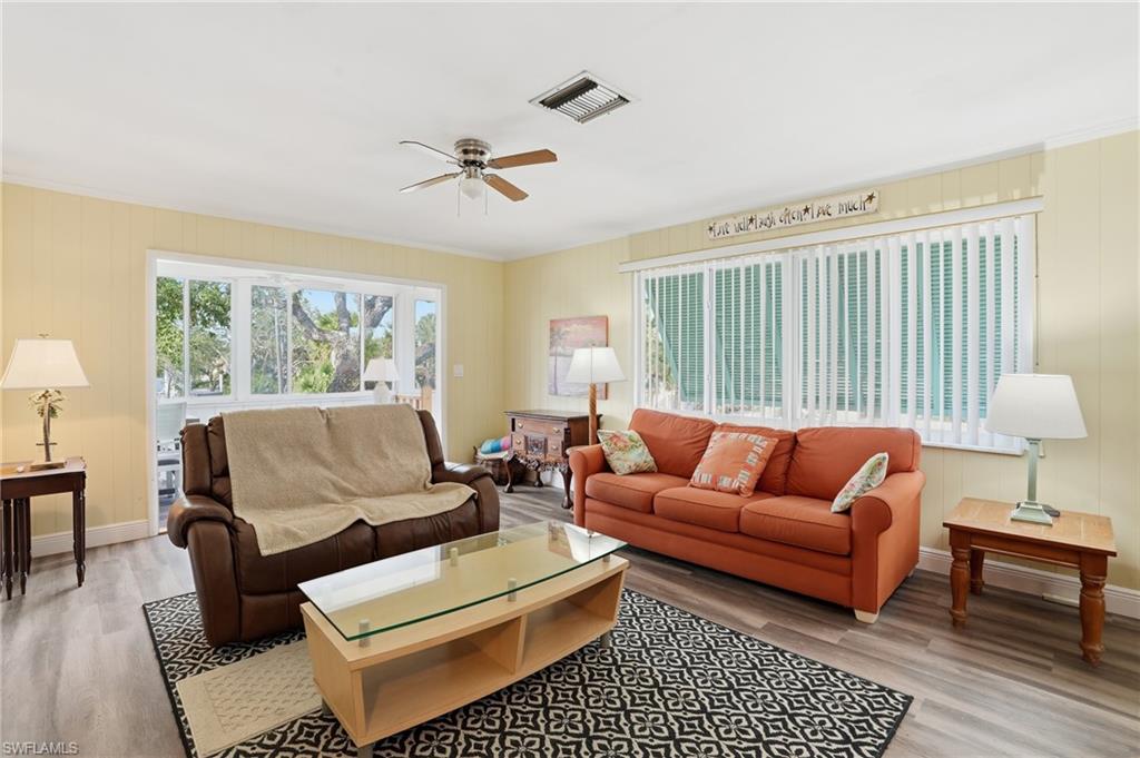 5474 Oak Ridge Avenue Fort Myers Beach, FL 33931 - Photo 26 of 50 a living room with furniture and a window