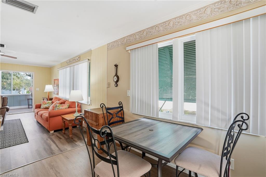 5474 Oak Ridge Avenue Fort Myers Beach, FL 33931 - Photo 29 of 50 a living room with furniture and window