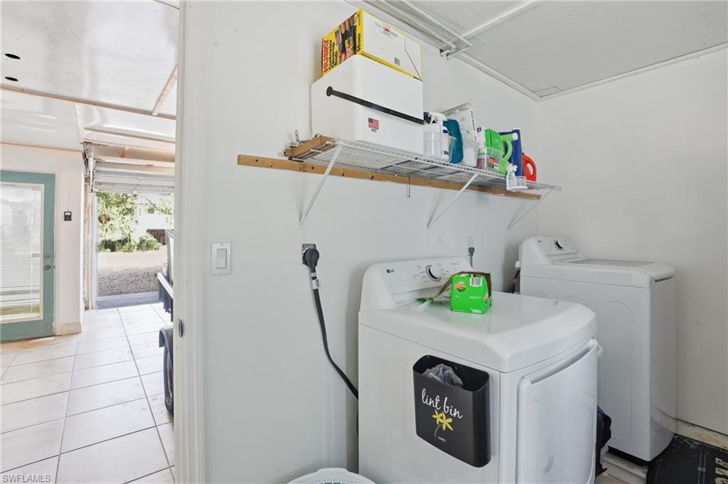 5474 Oak Ridge Avenue Fort Myers Beach, FL 33931 - Photo 42 of 50 a utility room with dryer and washer