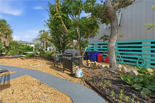 a view of a backyard with sitting area