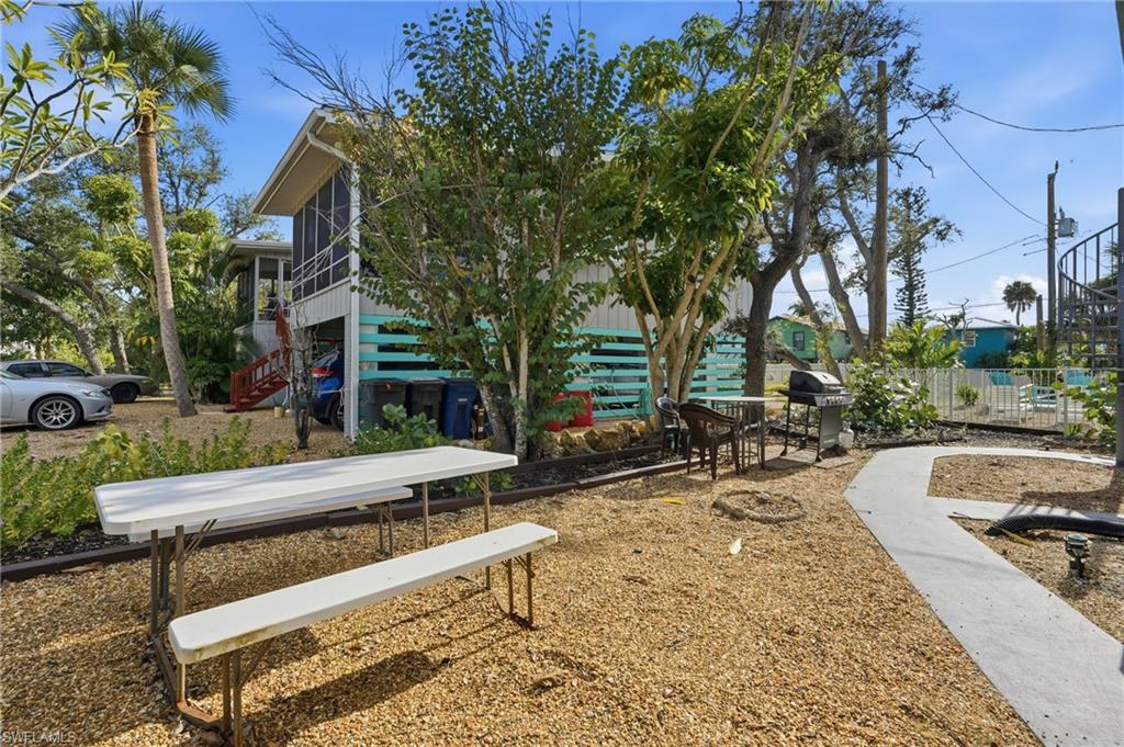 5474 Oak Ridge Avenue Fort Myers Beach, FL 33931 - Photo 47 of 50 a view of a backyard with sitting area