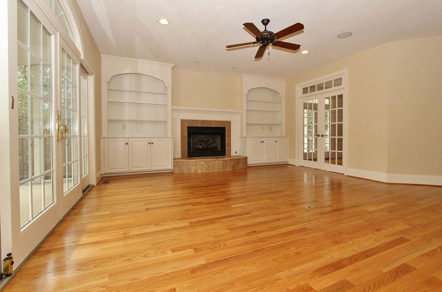 136 Claybrook Court Blue Ridge, VA 24064 - Photo 19 of 86 a view of a livingroom with a fireplace a ceiling fan and wooden floor