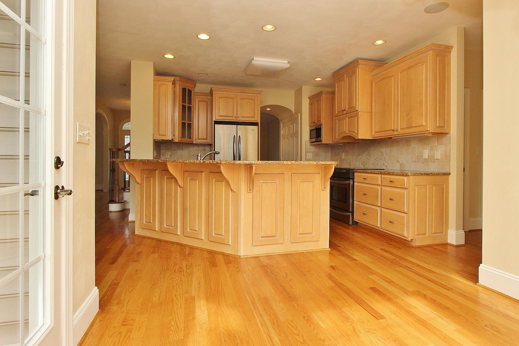 136 Claybrook Court Blue Ridge, VA 24064 - Photo 24 of 86 a view of a kitchen with kitchen island white cabinets and stainless steel appliances