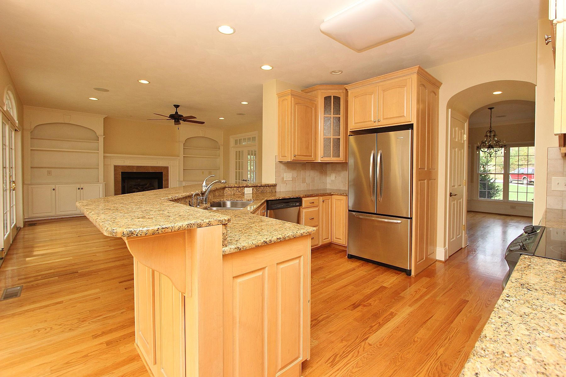 136 Claybrook Court Blue Ridge, VA 24064 - Photo 26 of 86 a kitchen with stainless steel appliances granite countertop a refrigerator a sink dishwasher and a stove with wooden floor