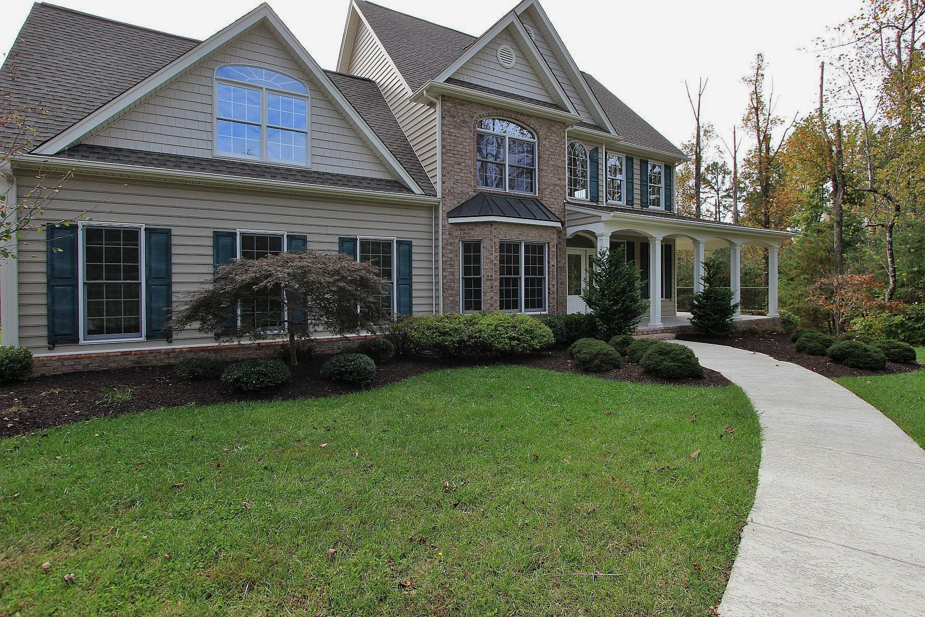 136 Claybrook Court Blue Ridge, VA 24064 - Photo 6 of 86 a front view of a house with a garden