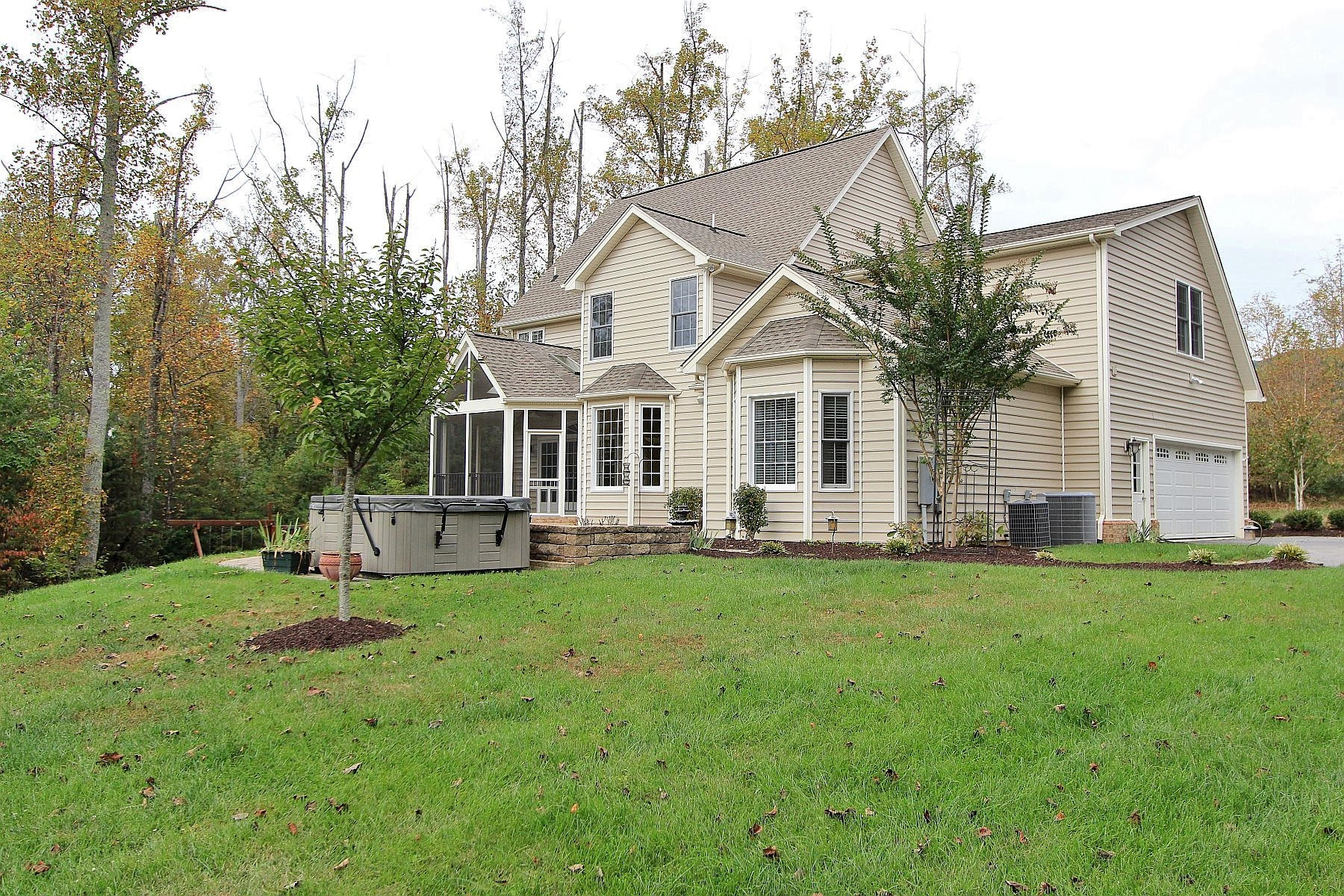 136 Claybrook Court Blue Ridge, VA 24064 - Photo 77 of 86 a front view of a house with a yard and trees