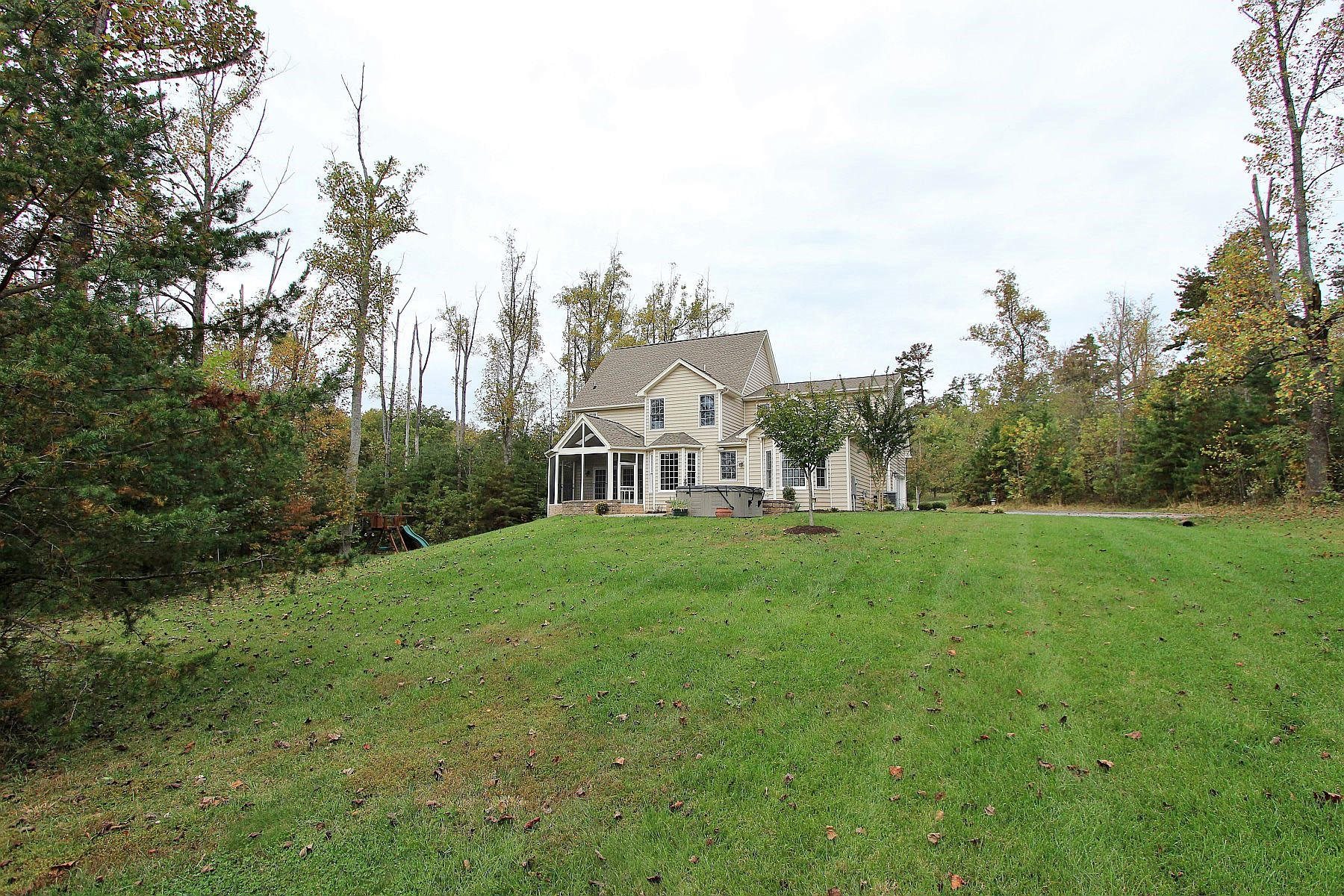 136 Claybrook Court Blue Ridge, VA 24064 - Photo 78 of 86 a view of a house with a big yard next to a yard