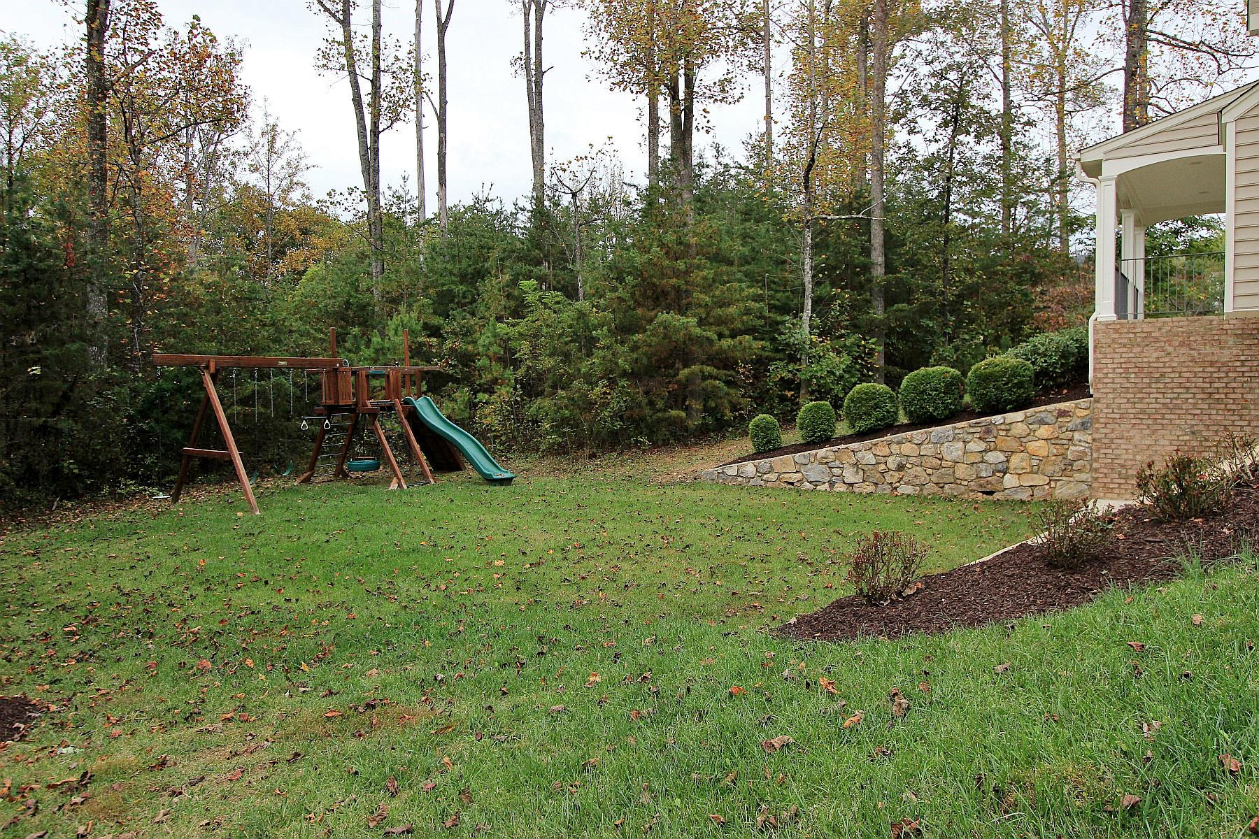 136 Claybrook Court Blue Ridge, VA 24064 - Photo 82 of 86 a view of a backyard with a slide