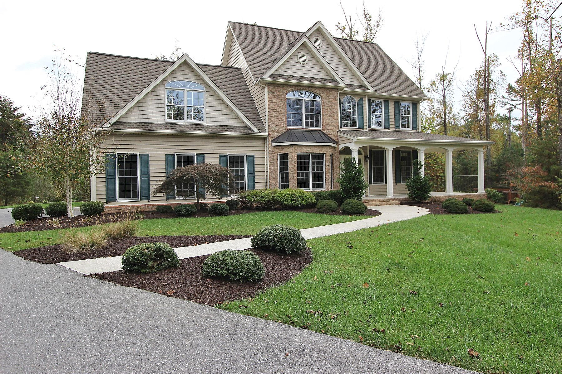 136 Claybrook Court Blue Ridge, VA 24064 - Photo 85 of 86 a front view of a house with a yard