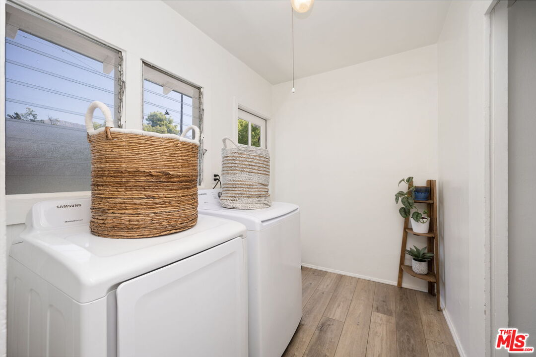 1732 Fiske Avenue Pasadena, CA 91104 - Photo 11 of 23 a view of washer and dryer with wooden floor