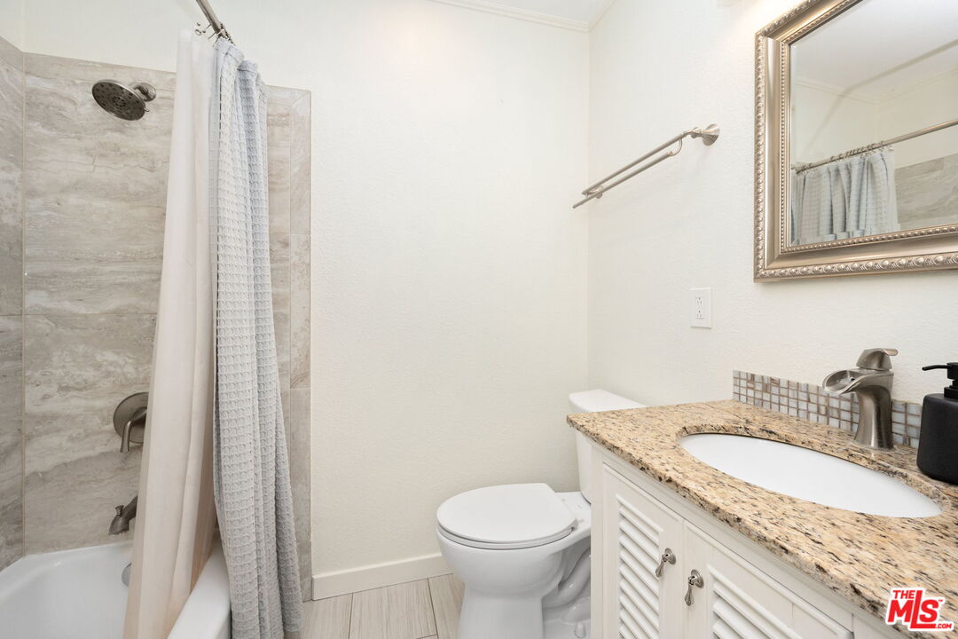 1732 Fiske Avenue Pasadena, CA 91104 - Photo 14 of 23 a bathroom with a granite countertop sink toilet and shower
