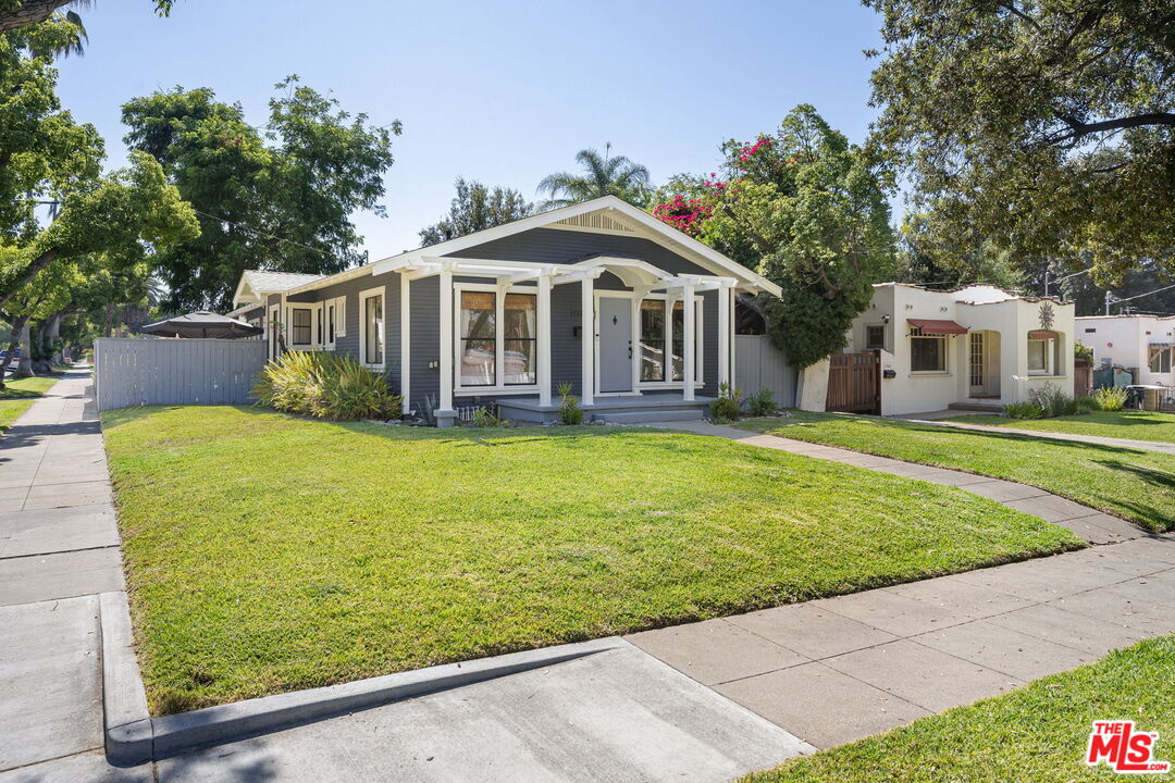 1732 Fiske Avenue Pasadena, CA 91104 - Photo 23 of 23 a front view of a house with a garden and trees