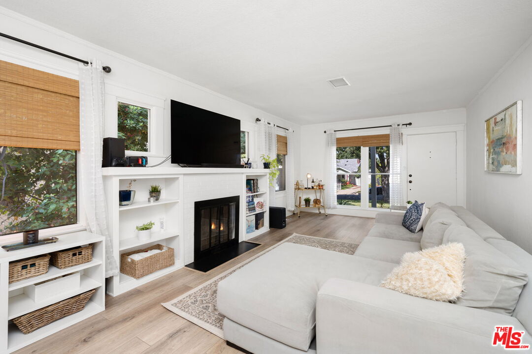 1732 Fiske Avenue Pasadena, CA 91104 - Photo 3 of 23 a living room with fireplace furniture and a flat screen tv