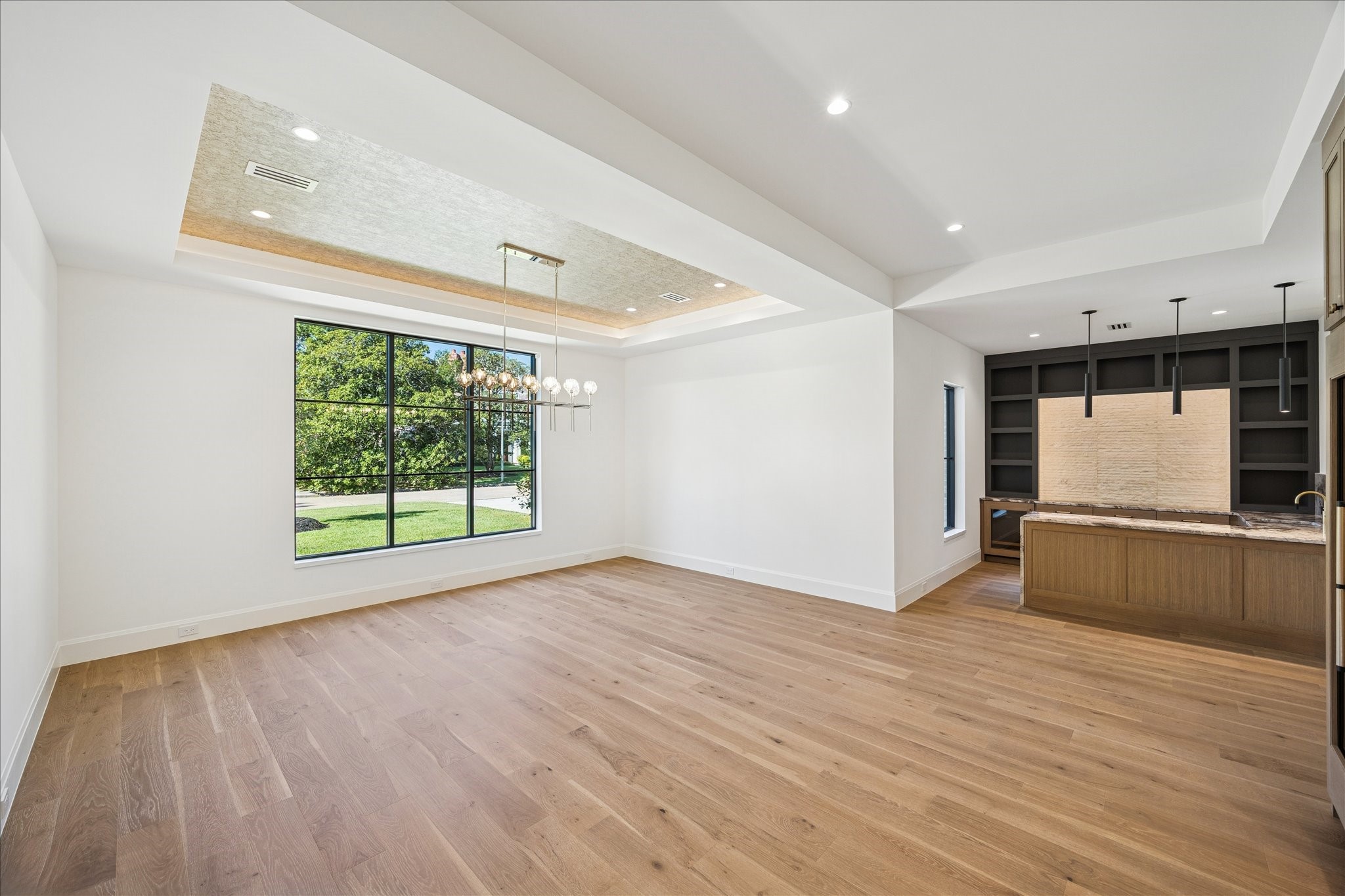 267 Maple Valley Road Houston, TX 77056 - Photo 11 of 40 wooden floor in an empty room with a window