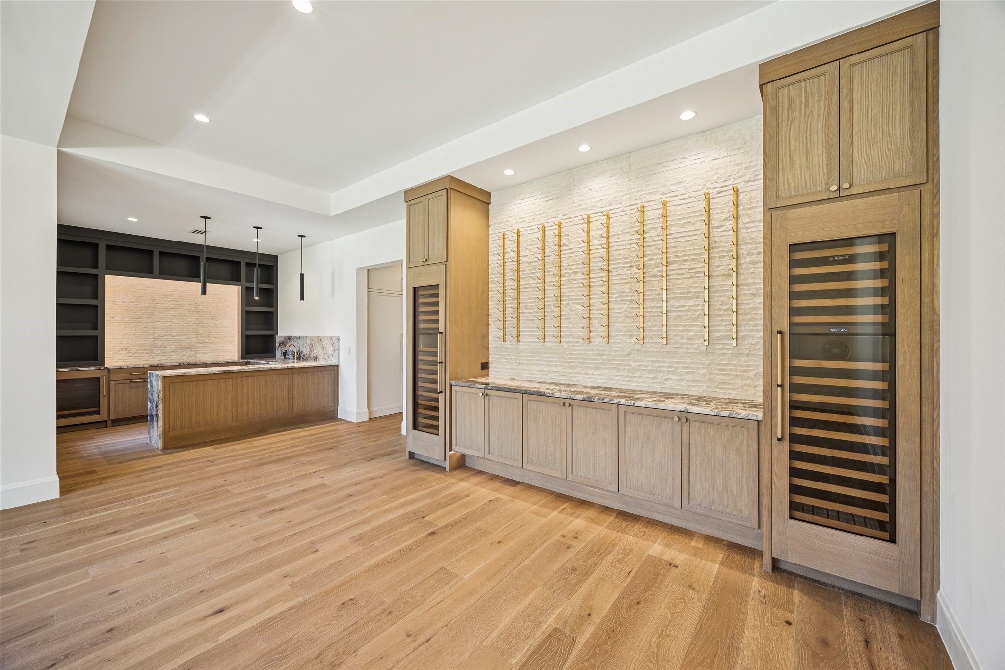 267 Maple Valley Road Houston, TX 77056 - Photo 13 of 40 a view of a kitchen with kitchen island stainless steel appliances wooden floor and windows