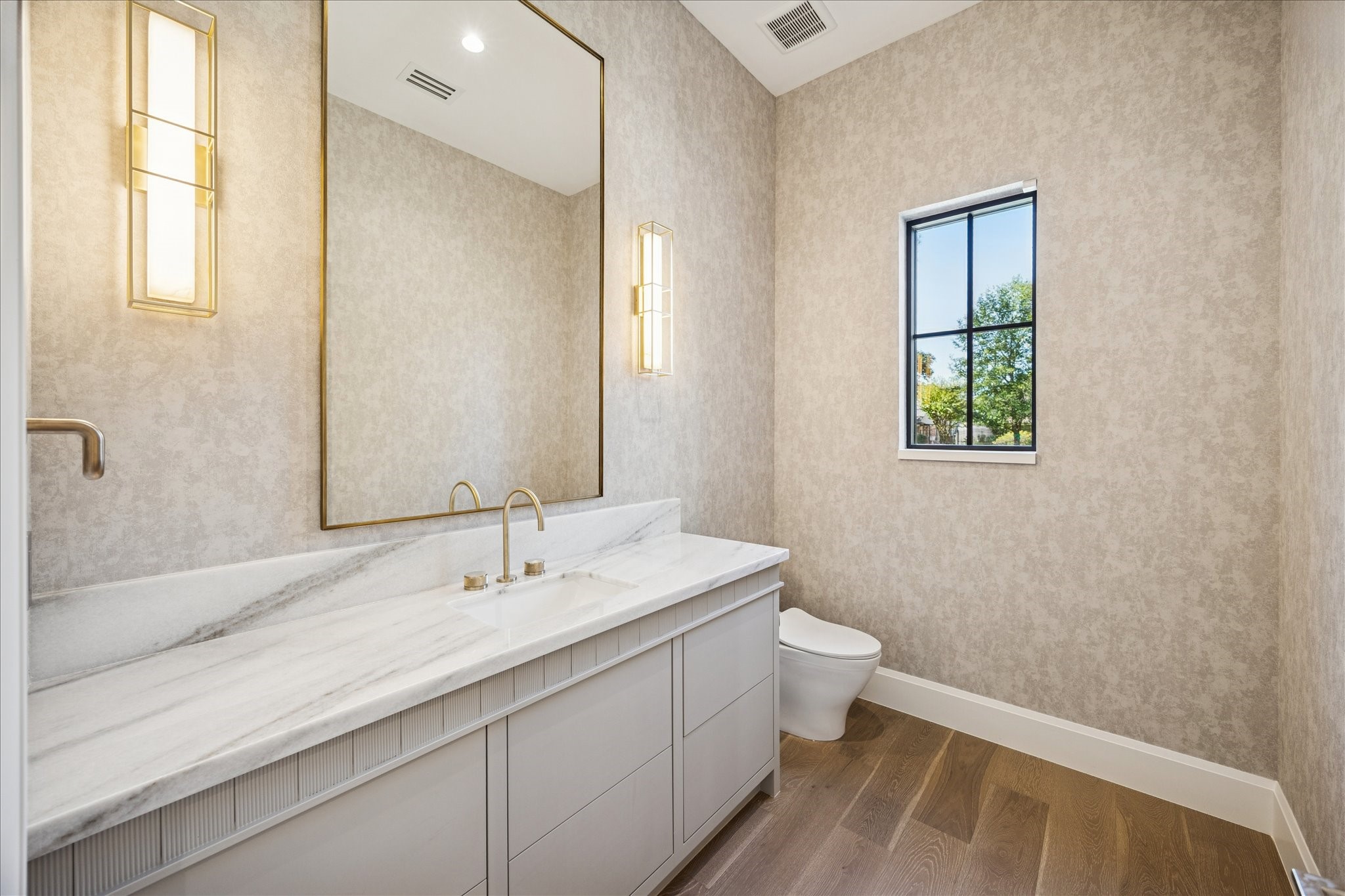 267 Maple Valley Road Houston, TX 77056 - Photo 15 of 40 a bathroom with a sink a toilet and a mirror